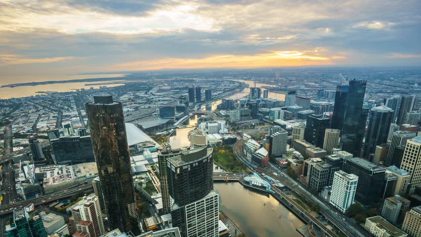 An aerial view of Melbourne cityscape including Yarra River and Victoria Harbour in the distance. Timelapse during sunset with beautiful sun ray bursting through fast moving clouds.
Timelapse Zoom In. Royalty-Free Stock Footage #10183700