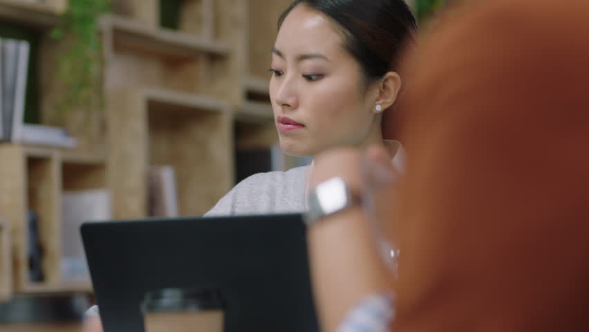 multi ethnic corporate team meeting asian business woman sharing ideas discussing startup company marketing strategy in office management presentation