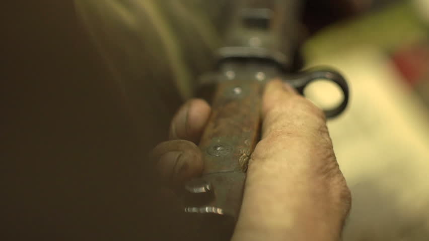 the man pulls out a bigger knife than the metal cover