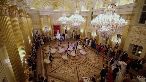 MOSCOW - SEP 16, 2017: Full-dressed pairs dance on ballroom parquet during Great Catherine Ball (dance party) in Tsaritsyno