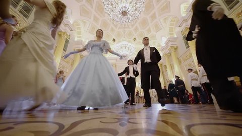 MOSCOW - SEP 16, 2017: People in historical dresses walk in dance during Great Catherine Ball (dance party) in Tsaritsyno. Slow motion