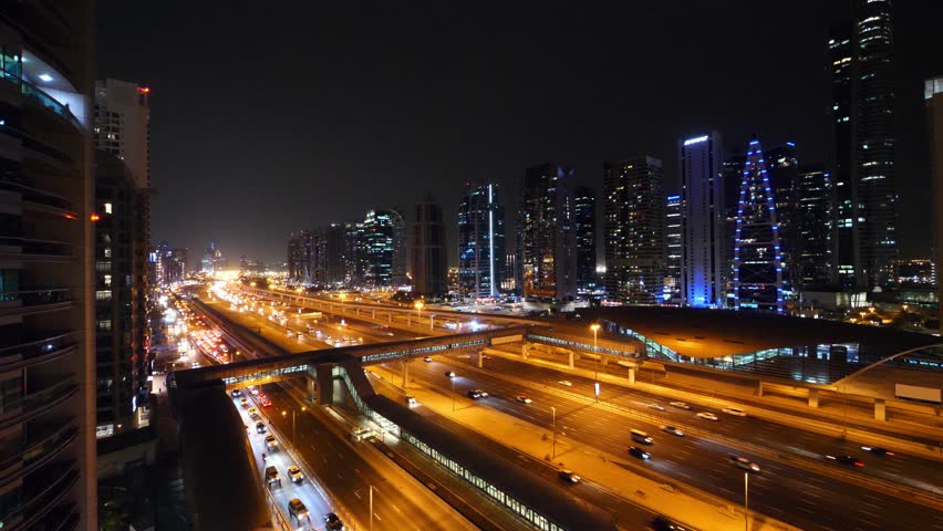 Scenic view at night with traffic in Jumeirah Lake Towers. Dubai, UAE. | Shutterstock HD Video #1018383343
