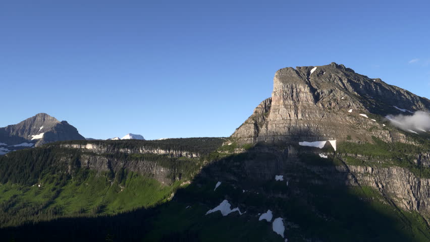 a summer morning view of reynolds mountain at glacier national park in montana, usa