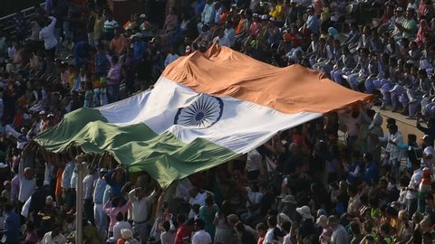 Amritsar, Panjab/india-oct 2018: Most spectacular flag ceremony in wagah border India, crowd passing Indian flag.