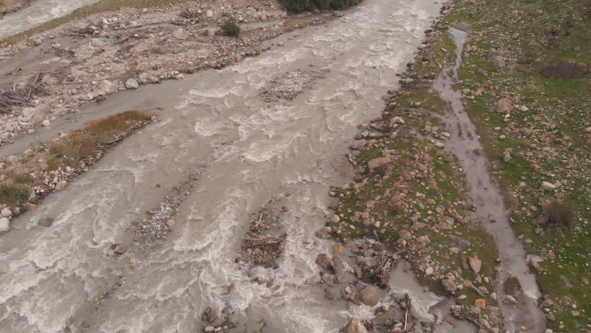 Aerial shot of rough mountain river.