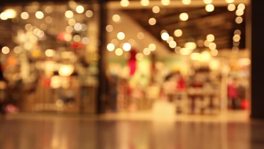 De-focused of crowd passenger with luggage traveling by airplane walking at duty free shop in the international airport, blur or bokeh background/ full HD, 1080p 