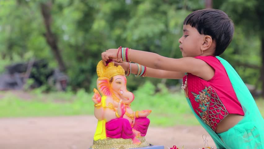 Little Indian girl child with lord ganesha and praying , Indian ganesh festival Royalty-Free Stock Footage #1018410907