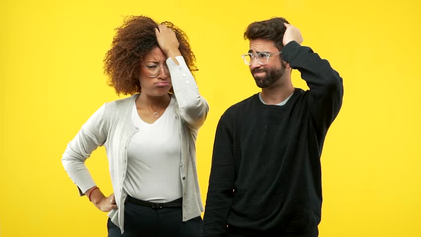 Young african american woman and caucasian man worried and overwhelmed, forgetful, realize something, expression of shock at having made a mistake Royalty-Free Stock Footage #1018412503