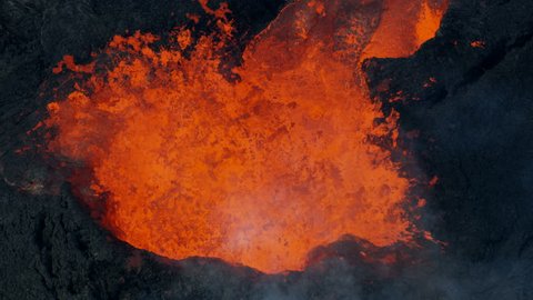 Aerial view open fissures ejecting rivers of hot magma toxic gases from earths mantle destroying property lava rock solidifying Kilauea Hawaii USA RED WEAPON