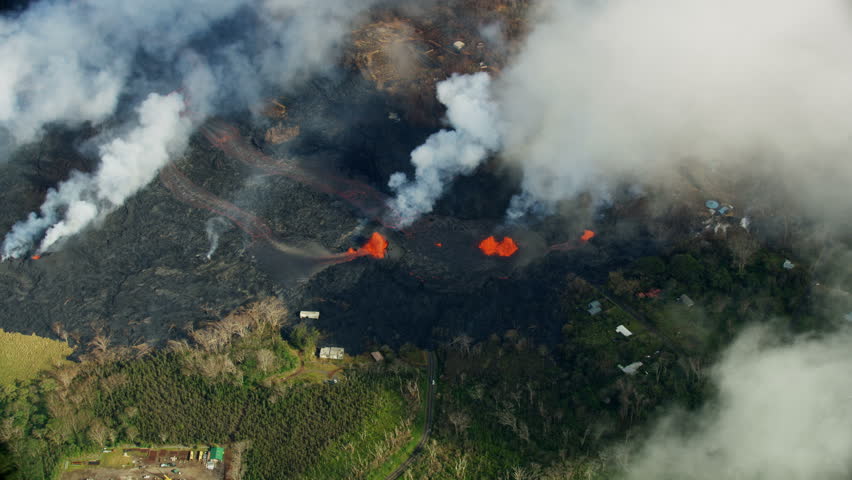 Aerial view Kilauea destruction hot magma and toxic gases pouring from earths crust destroying homes trees and property lava rock solidifying Hawaii USA RED WEAPON