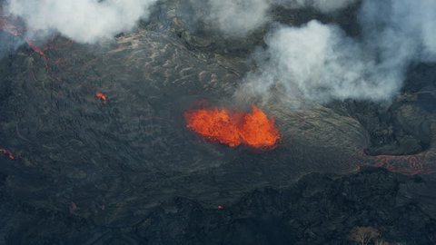 Aerial view of red hot magma pouring from Kilauea volcano lava rock solidifying on landing a natural phenomenon Hawaii USA RED WEAPON