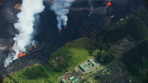 Aerial view nearby fissures erupting active volcano destruction Puna Geothermal Venture industrial plant threatened by flows from Kilauea Big Island Hawaii USA RED WEAPON