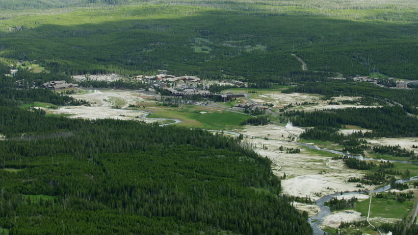Aerial view of Old Faithful Visitor center a tourist destination and designated Supervolcano area Midway geyser basin Yellowstone National Park Wyoming USA RED WEAPON