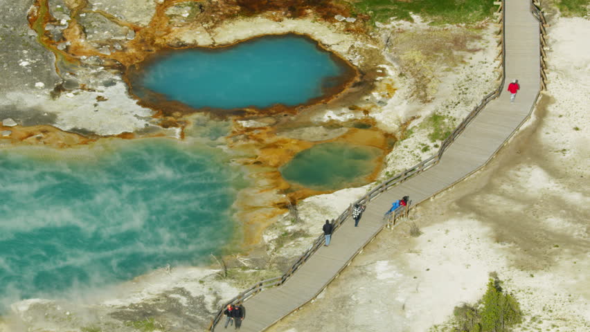 Aerial view of Yellowstone Basin hot geyser mineral rich water geothermal boiling springs Plateau area in the Yellowstone National Park Wyoming USA RED WEAPON