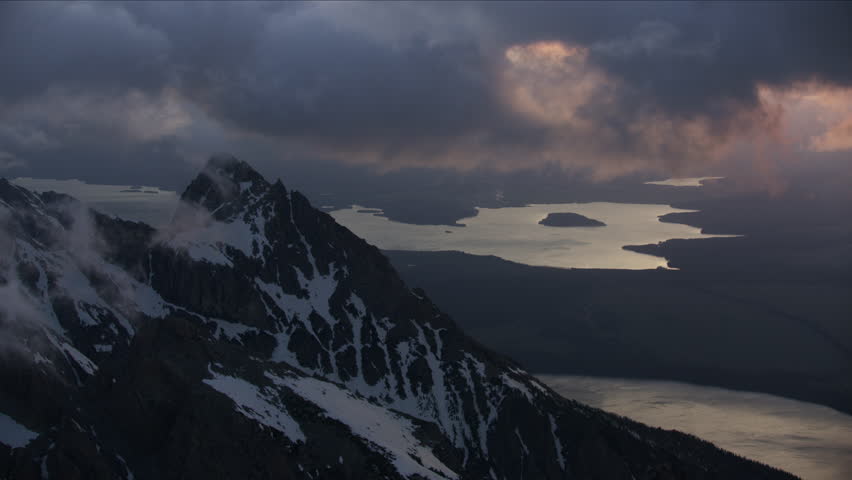 Aerial sunrise view of Jackson Lake from Mt Moran Grand Teton mountains misty cloud Yellowstone National Park Wyoming Western USA RED WEAPON