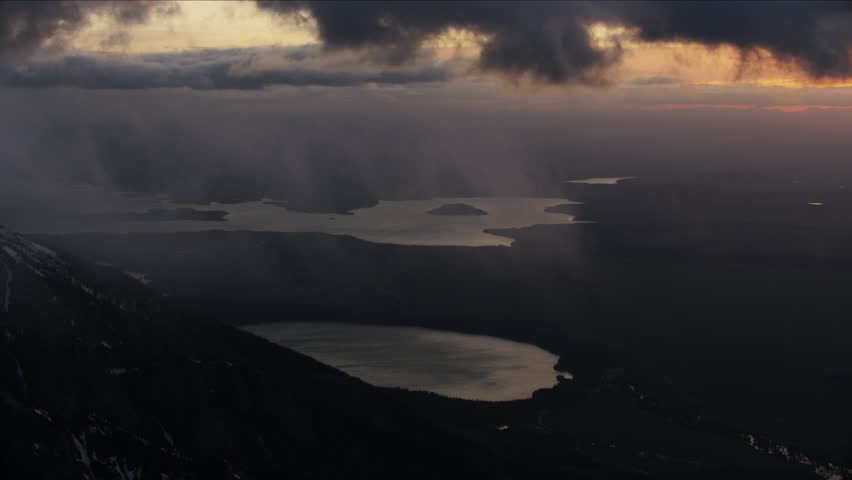 Aerial sunrise view of Jackson Lake Grand Teton mountains misty cloud Yellowstone National Park Wyoming Western USA RED WEAPON