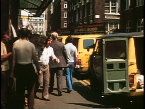 LONDON, ENGLAND, 1976, Fleet Street, loading papers into delivery trucks, 1970s