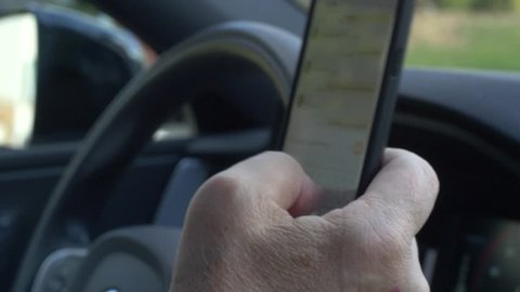 Driver texting behind the wheel