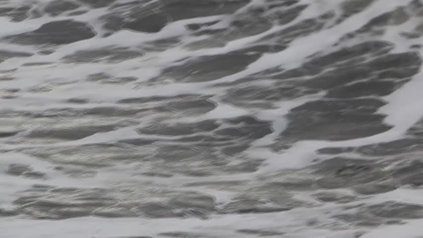Closeup of ocean wave crashing