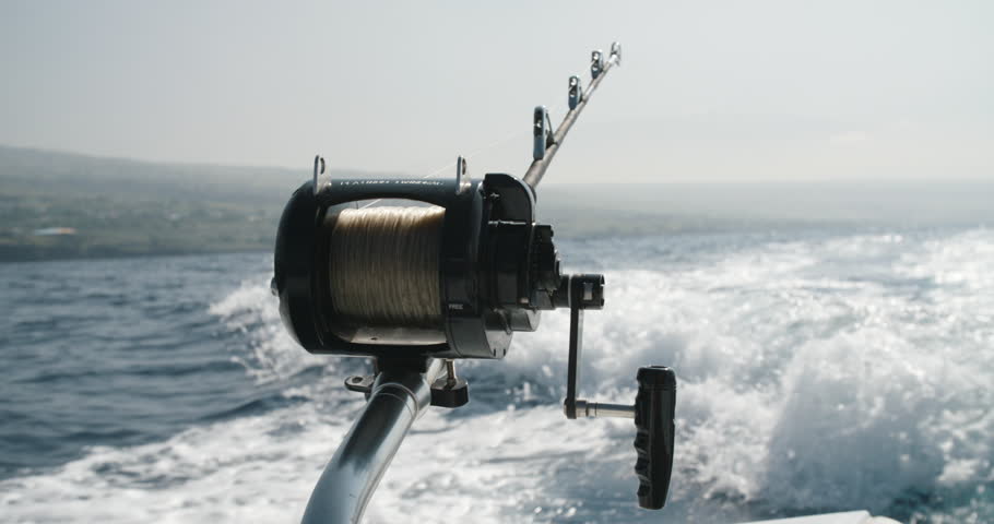 Deep sea trolling with ocean fishing reel and rod Royalty-Free Stock Footage #1018435192
