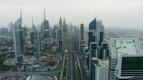 Dubai - March 2018: Aerial city view of Sheikh Zayed road skyscrapers metro rail commercial area modern vehicle transport highway UAE RED WEAPON