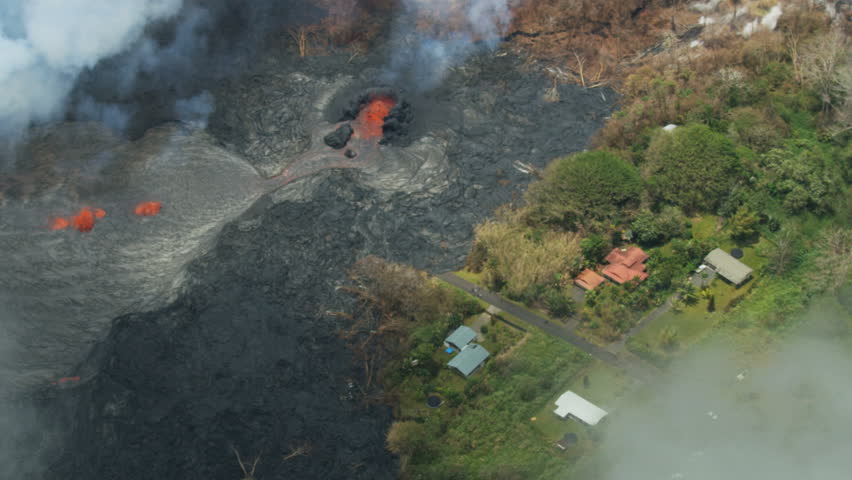 Aerial 2018 view of Kilauea destruction hot moving lava and toxic gases pouring from open fissures destroying property Hawaii USA RED WEAPON