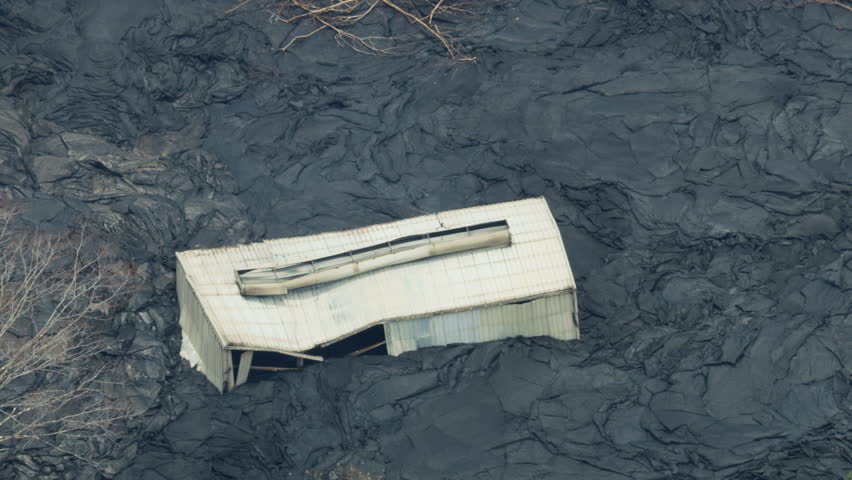 Aerial view of lava rock solidifying when cooled volcanic magma destroyed surrounding building landscape and homes Kilauea Hawaii USA RED WEAPON