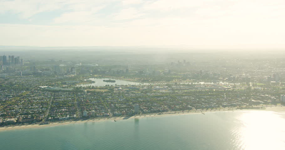 Aerial view at sunrise from Port Phillip Bay across Middle Park with Albert Park Lake Melbourne Victoria Australia