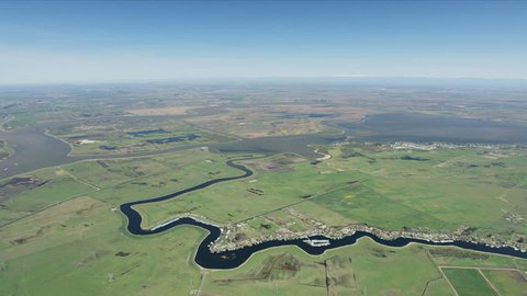 Aerial of Sacramento river tributaries under blue sky lowlands farm land for rural countryside economy Bethel Island community RED WEAPON