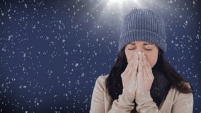 Digital composite video of woman sneezing against snowflakes background 4k
