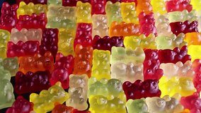 Gummy bear colorful candy rotating texture pattern closeup footage