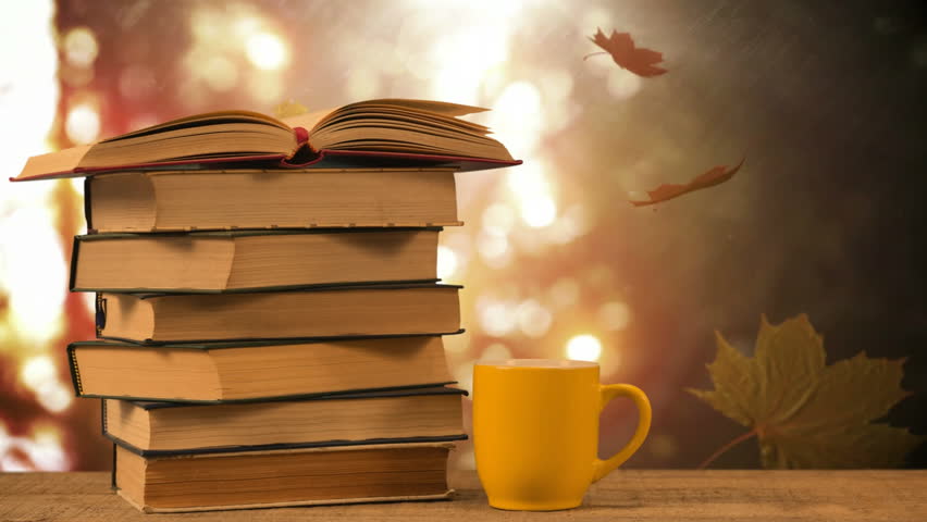 Stack of books and coffee cup against falling autumn leaves and bright background 4k