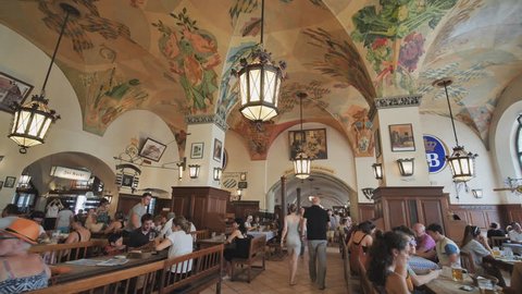 Munich, Germany - August 5, 2018: Interior of famous Hofbrauhaus pub in Munich. Hofbrauhaus is a biggest brewery and beer pub owned by the Bavarian state government in Munich, Bavaria, Germany, Europe