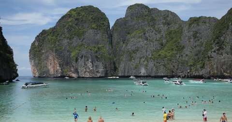 PHI PHI ISLAND, THAILAND - JANUARY 25, 2018 Tourists People Swimming on Maya Bay Beach Phi Phi Tropical Island in Thailand