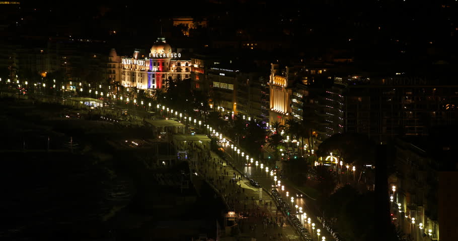 NICE, FRANCE - SEPTEMBER 25, 2014 Aerial View of Nice City People Walk on Famous Promenade and Cars Traffic Night