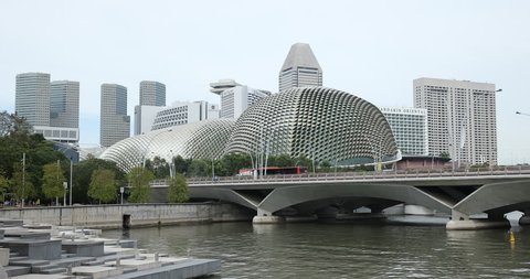 SINGAPORE, SINGAPORE - JANUARY 28, 2018 Singapore City Skyline with People and Cars Traffic on Esplanade Bridge Landmark