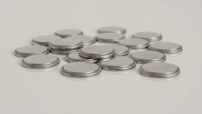 Taking one button battery from many close-up 4K video