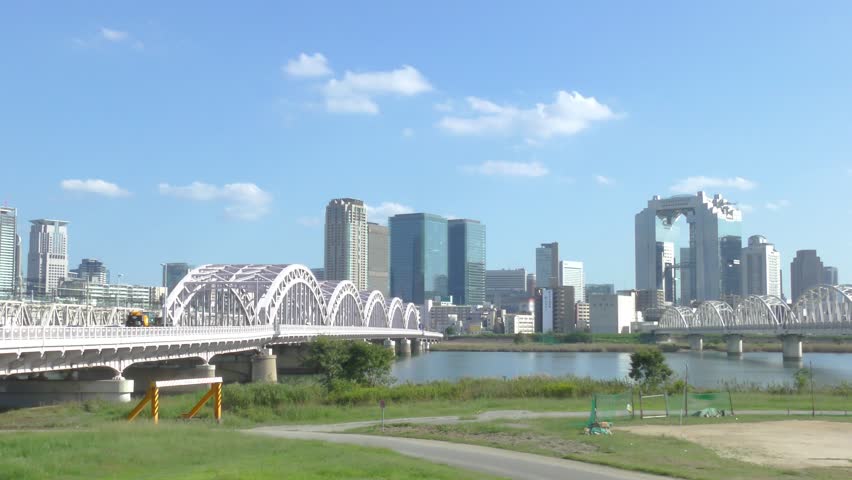 Buildings in Umeda district, Osaka, Japan seen from the riverbed in Juusou district