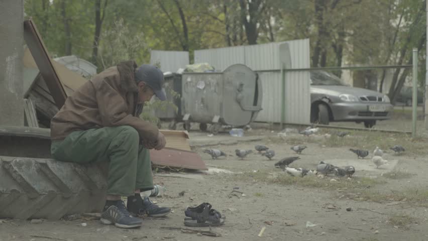 Poverty. Beggar homeless man. Poverty and vagrancy.