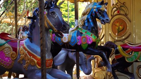 Amazing close up view on vintage circus carousel retro merry go round horse ride attraction at amusement park carnival