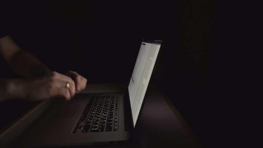 Federal crime. Man, allegedly criminal hacker, is trying to hack government server at night. Laptop with Russian layout. Can be used for internet defence project or concept. Night scene. Close up. Royalty-Free Stock Footage #1018517872