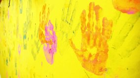 Children's hand prints on the wall. Little artists. Multicolored hands. Children's entertainment and creativity. Games in the company of friends. Happy childhood - Powered by Shutterstock - Get 15% off with code: PIKWIZARD15