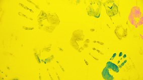 Children's hand prints on the wall. Little artists. Multicolored hands. Children's entertainment and creativity. Games in the company of friends. Happy childhood - Powered by Shutterstock - Get 15% off with code: PIKWIZARD15
