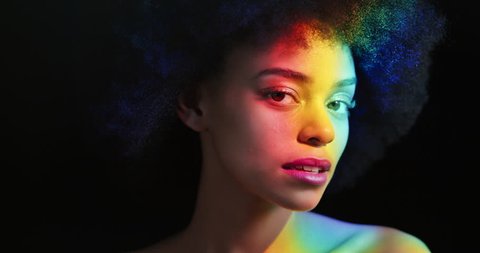 multicolor portrait beautiful woman with funky afro smiling confident enjoying individual expression natural feminine beauty colorful light on black background lgbt pride concept – Video có sẵn