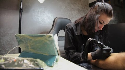 VINNITSA, UKRAINE, OKTOBER 5, 2018: Salon tattoo. Tattoo artist working. Tattoo artist make tattoo at the studio