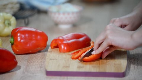 Cutting Bell Pepper. Making tortilla with chicken and bell pepper.