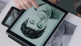 team of engineers developing facial recognition software technology using digital tablet computer brainstorming design solution sharing project ideas in office meeting top view - Powered by Shutterstock - Get 15% off with code: PIKWIZARD15