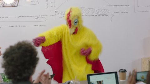 dancing chicken happy business people enjoying funny dance party in boardroom meeting celebrating successful victory crazy rooster high five colleagues excited office presentation
