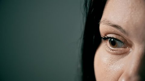 Close-up of a woman's face, a woman at a psychologist's reception, she shares the secrets of her personal life, maybe she was raped and she asks for the help of a specialist, anxiety in her eyes