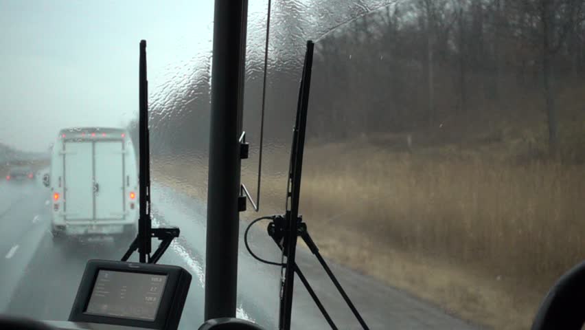 Rain Droplets Falling Against Windshield On Highway Behind Truck Super Slow M
